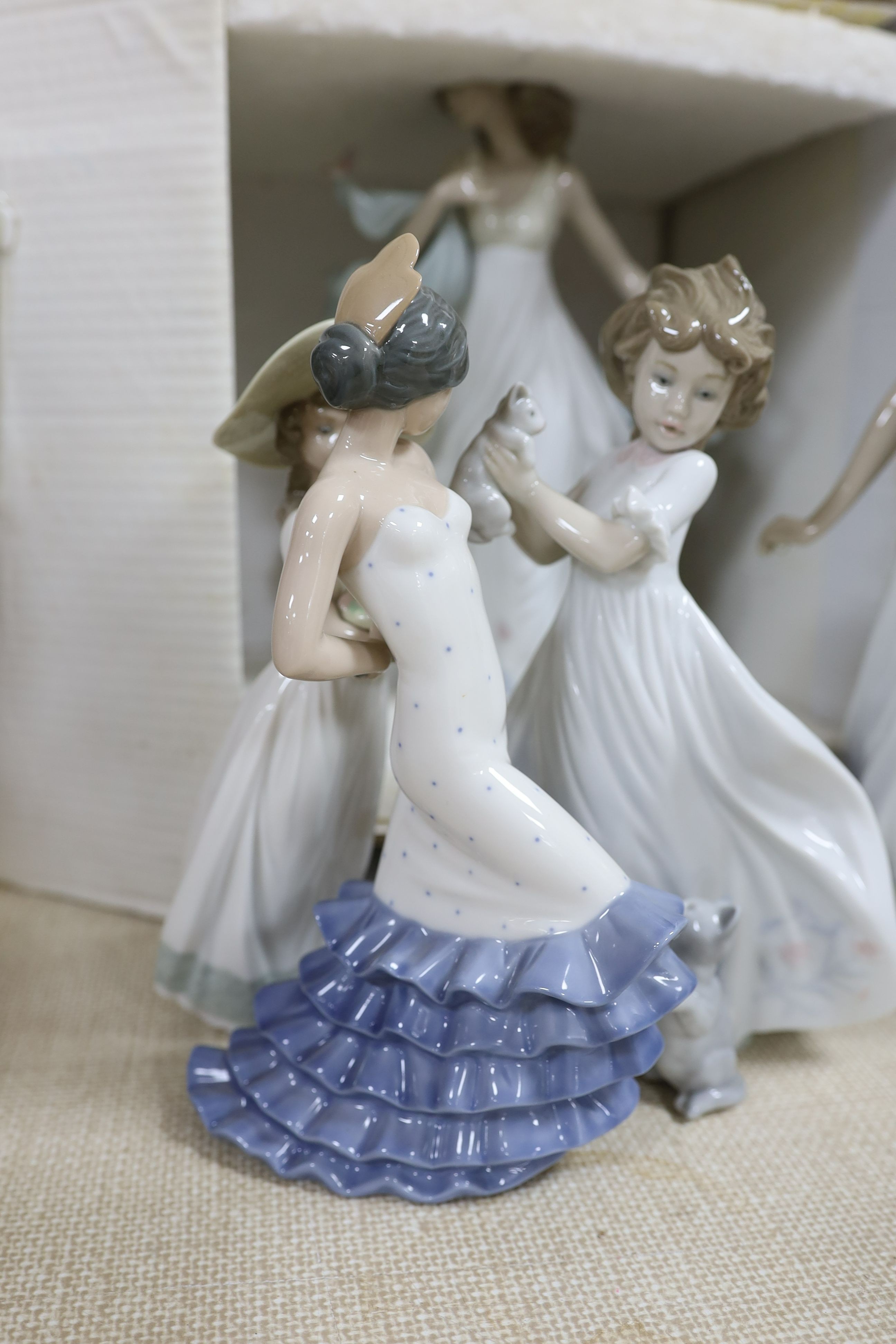 A selection of Lladro and Nao figures